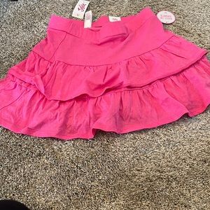 NWT justice brand girls size 10 pink shimmer skorts.